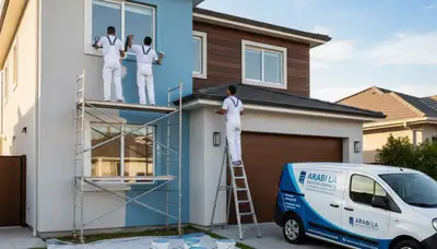 Professional house painters in New Orleans LA applying fresh exterior paint to residential home